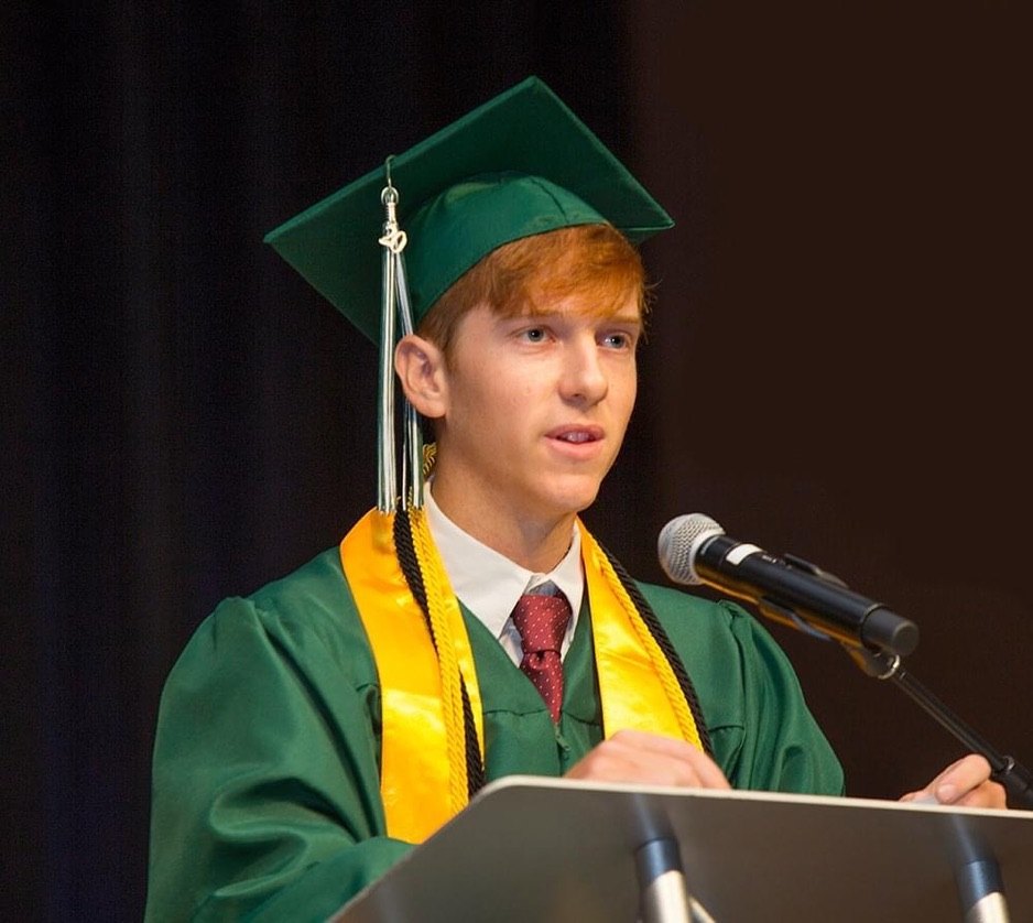 Zach speaking at a graduation ceremony