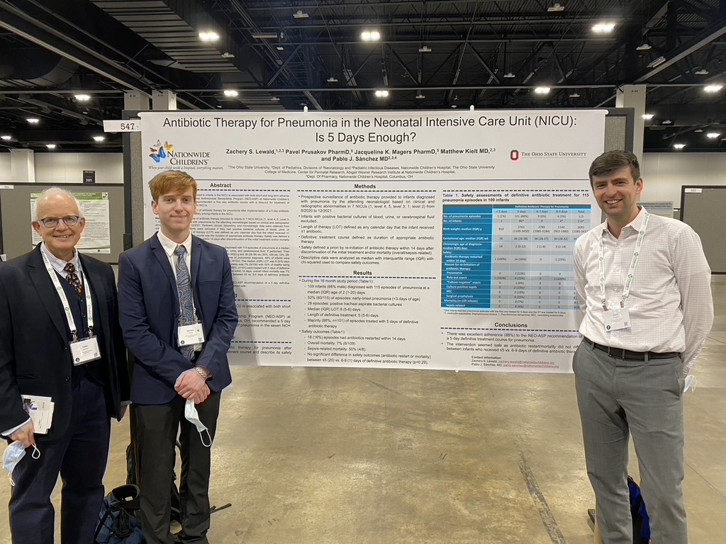 Research team standing in front of the neonatal pneumonia antibiotic therapy poster